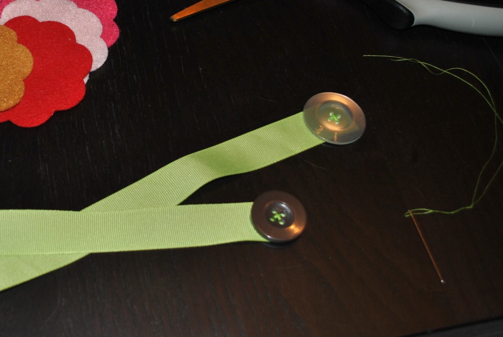 Hand-sew buttons to ribbon