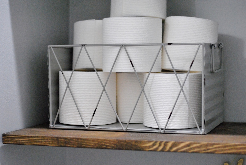 Use wire baskets for a farmhouse look on your DIY "floating shelves"