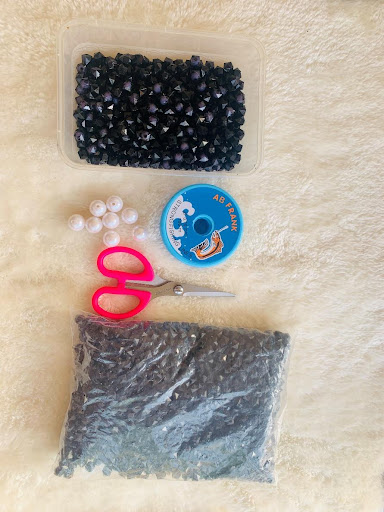 Materials needed to make a beaded purse