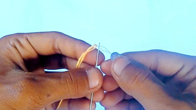 Thread an embroidery needle with a threader step 3