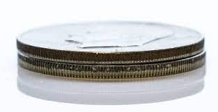 Another way to check is by checking the coin's rim. A silvery rim with a light blue streak indicates a 79/21 copper core with an 80/20 silver finish.
