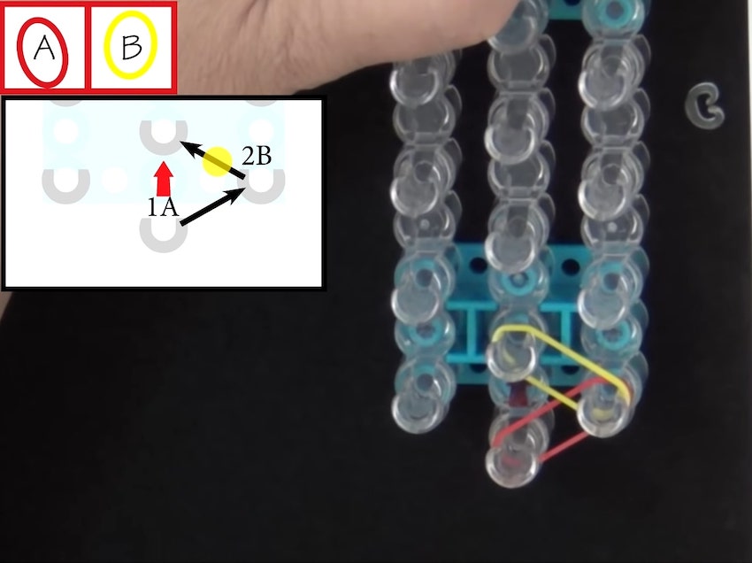 Stretch the 2nd band between the outside middle peg (where the 1st band is also wrapped) and the next middle peg on the left 