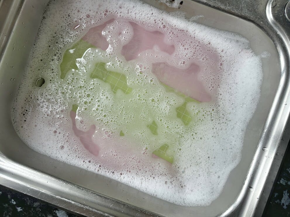 Cricut mats soaking in the sink