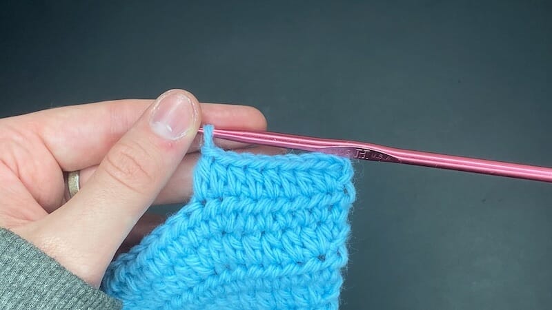 Half double crochet increase into the first stitch of the row, followed by 7 half double crochets (HDC INC, 7 HDC)